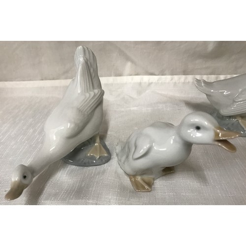 78 - A collection of 7 Nao Lladro geese. Largest 13cm h.