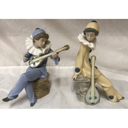 79 - Nao Lladro pair of figures, musicians with instruments. 19 and 20cm h.