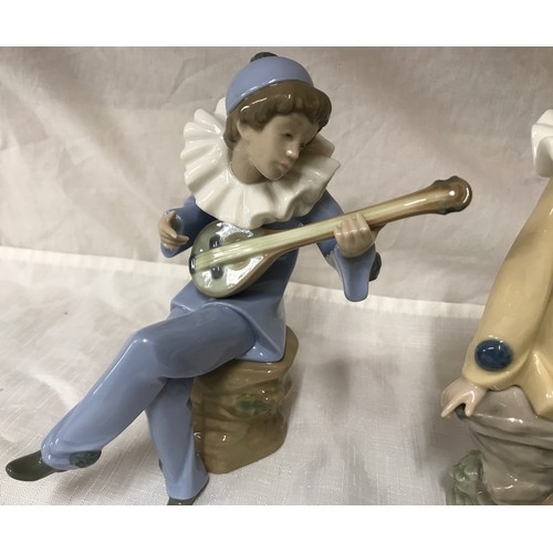 79 - Nao Lladro pair of figures, musicians with instruments. 19 and 20cm h.