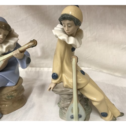 79 - Nao Lladro pair of figures, musicians with instruments. 19 and 20cm h.