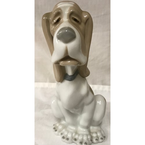 80 - A Nao Lladro tall figurine of a clown with dog 29.5cm h together with a Bassett hound 19cm h.