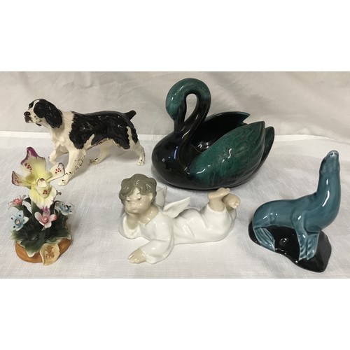 81 - A mixed lot of ceramics  to include: Lladro angel 7cm h, Poole seal 11cm h, Capodimonte flower 12cm ... 