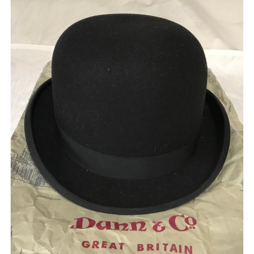 477 - A Dunn & Co black bowler hat size 7 1/4 with retail paper bag.