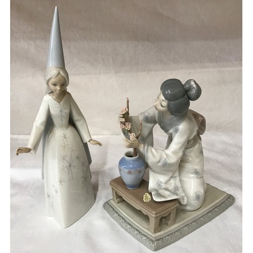 84 - Two  Lladro figurines, a Japanese girl arranging cherry blossom 19 h x 12 w x 16 at base and a wizar... 