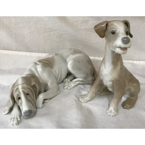 87 - Two large Lladro dogs. Hound 25cm h and a terrier 19cm h.