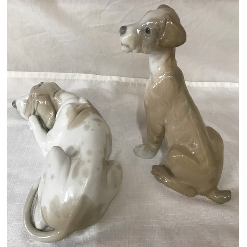 87 - Two large Lladro dogs. Hound 25cm h and a terrier 19cm h.