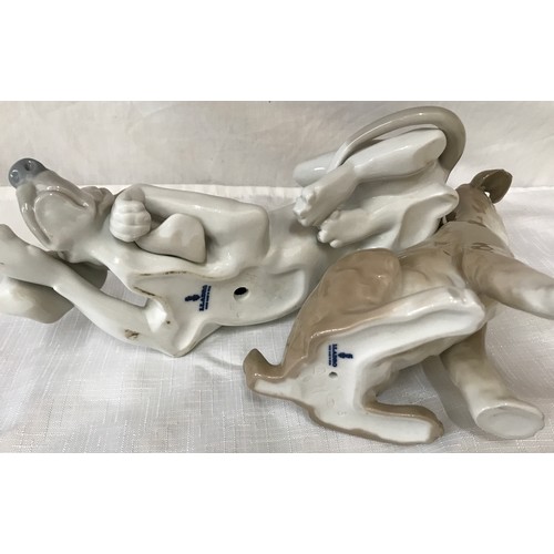 87 - Two large Lladro dogs. Hound 25cm h and a terrier 19cm h.