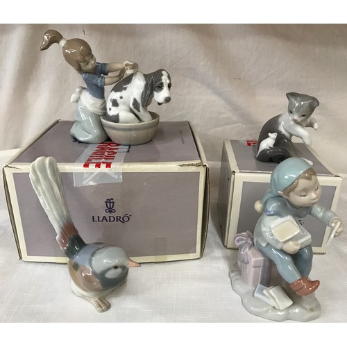 88 - Four Lladro figurines, 2 boxed comprising: Girl washing dog 12cm h, Cat with mouse 8cm h, Santa’s ma... 