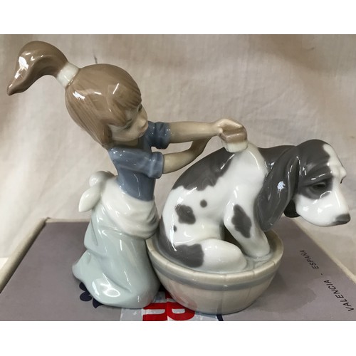 88 - Four Lladro figurines, 2 boxed comprising: Girl washing dog 12cm h, Cat with mouse 8cm h, Santa’s ma... 