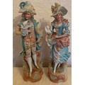 A pair of 19thC continental bisque figurines, a lady and gentlemen with doves. 47cm h.