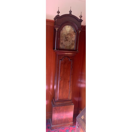 632 - A brass faced 8 day clock by W M Ward Spilsby in an oak case. 225cm h.