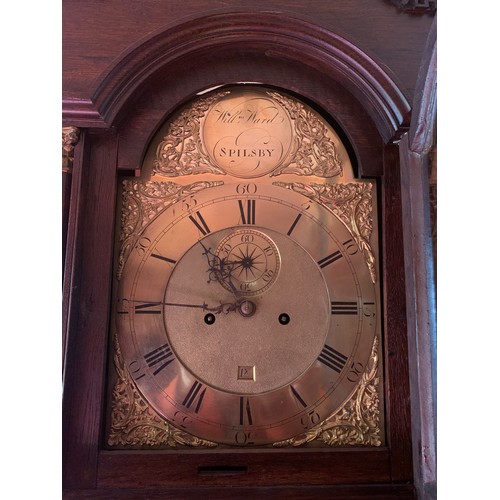 632 - A brass faced 8 day clock by W M Ward Spilsby in an oak case. 225cm h.