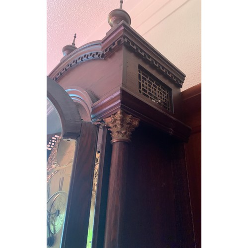 632 - A brass faced 8 day clock by W M Ward Spilsby in an oak case. 225cm h.