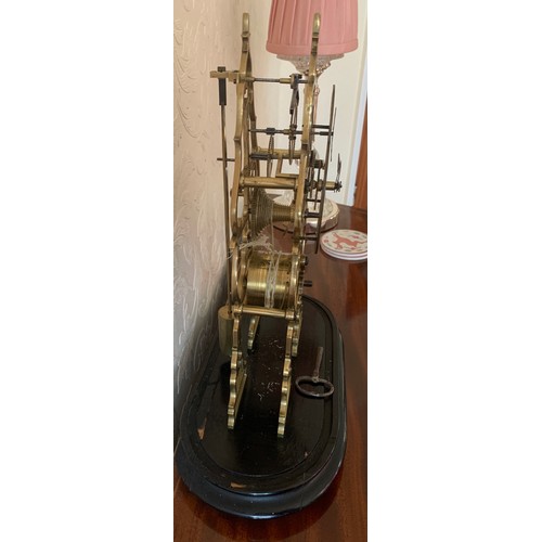 636 - A brass skeleton clock with fusee and cylindrical pendulum. 39cm h.