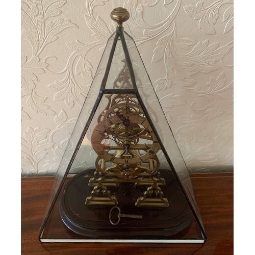 636 - A brass skeleton clock with fusee and cylindrical pendulum. 39cm h.