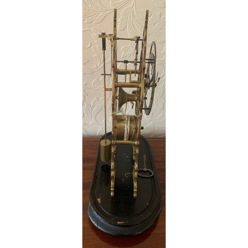 636 - A brass skeleton clock with fusee and cylindrical pendulum. 39cm h.