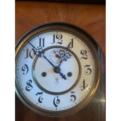 651 - A double weight walnut Vienna wall clock with subsidiary second hand. 127cm.