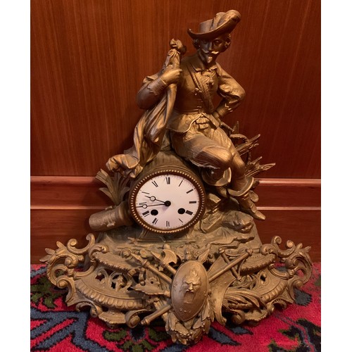 652 - A Victorian gilt metal mantle clock with seated gentleman to top. 42cm h.