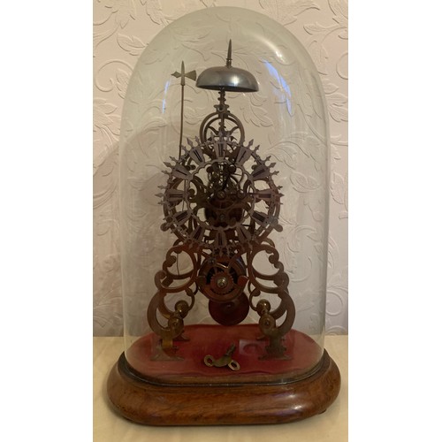 657 - A good quality single fusee skeleton clock striking on a bell with original dome. 57cm high includin... 