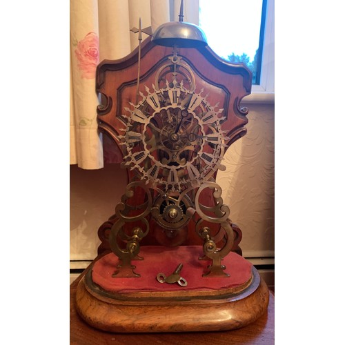 657 - A good quality single fusee skeleton clock striking on a bell with original dome. 57cm high includin... 