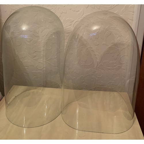 660 - Two damaged glass clock domes 47cm h.