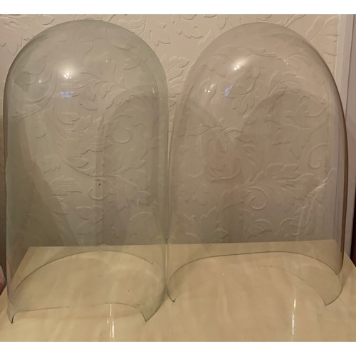 660 - Two damaged glass clock domes 47cm h.