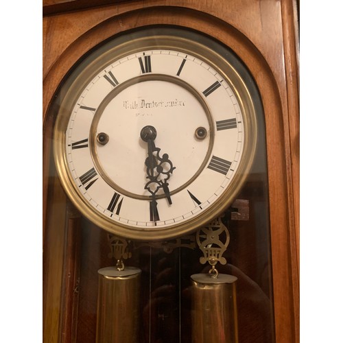 661 - A fine quality walnut triple weight Vienna clock. 136cm h.