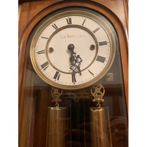 661 - A fine quality walnut triple weight Vienna clock. 136cm h.