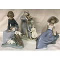 Nao Lladro figurines, Girl with Rabbits 17.5cm h, Girl with small bird 15.5cm h and an unmarked figu... 