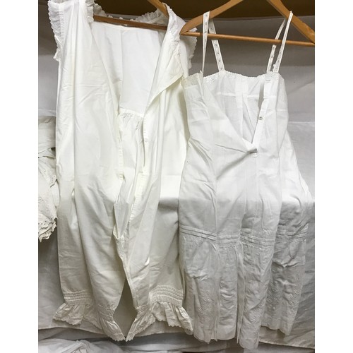 474 - Selection of white linen nightdresses and bloomers with a night cap and underskirt.