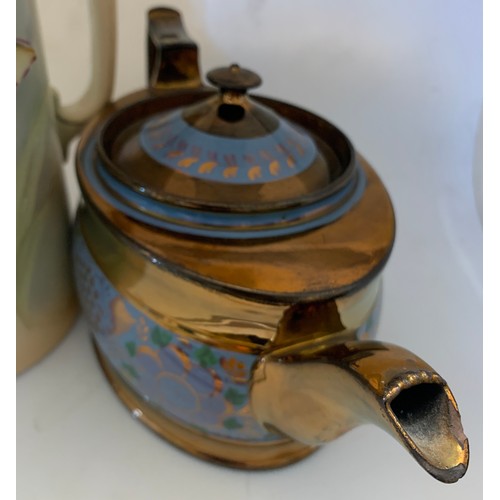52 - Copper lustre teapot and jug with daffodils.