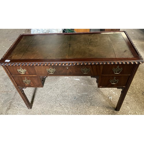 1194 - A mahogany leather topped writing desk. 115 l x 54 d x 78cms h.