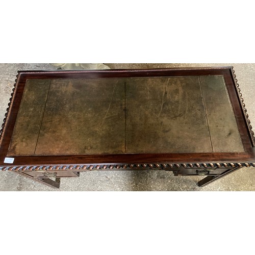 1194 - A mahogany leather topped writing desk. 115 l x 54 d x 78cms h.