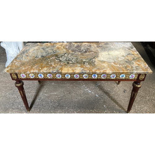 1196 - A French style marble topped coffee table with porcelain plaques and gilt mounts 99 w x 50 x 49cm.