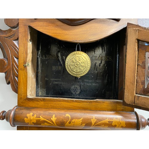 665 - A 19thC American drop dial wall clock with inlay. Frank Howe, Hull. With Pendulum and key.