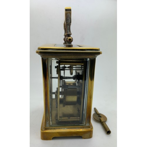 666 - A French brass cased carriage clock with white enamel face and Roman dial stamp 'Byrne Paris'. Key i... 