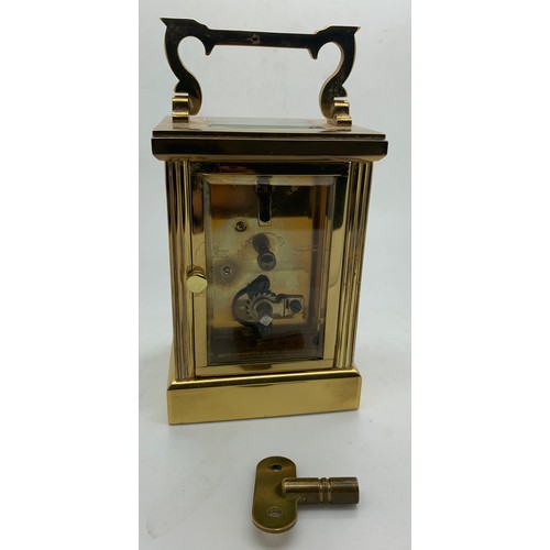 667 - An 'Imperial' brass carriage clock with key. Winds and goes. 15cm h with handle up.