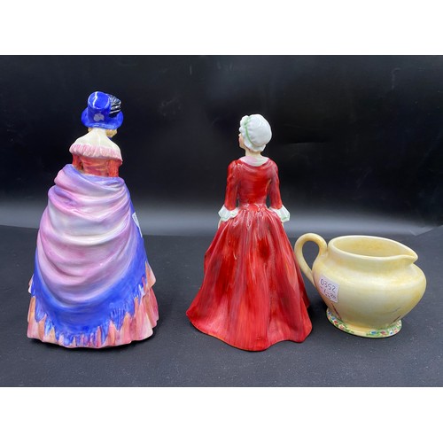 145 - Two Royal Doulton figurines 'Victorian Lady' and 'Gwyneth' reg. no. 842846 and a small Radford jug.