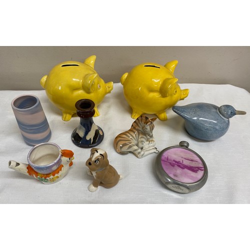 134 - A selection of ceramics to include a Universal Made in England dog, a Terrybaun pottery candlestick,... 