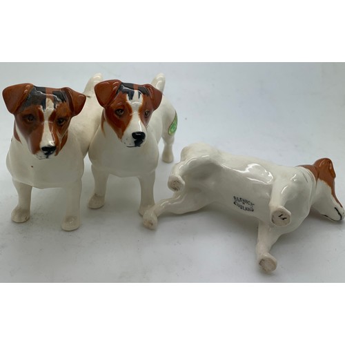 135 - Three Beswick dogs, two with original paper labels, tallest 7cm h.