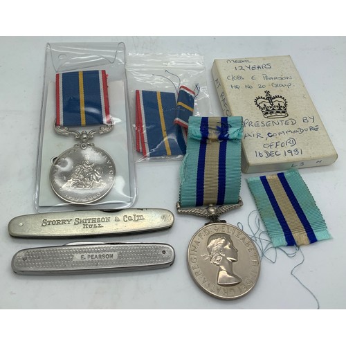 699 - A Royal Observer Corps medal awarded to C. Obs E. Pearson together with a National Service medal and... 