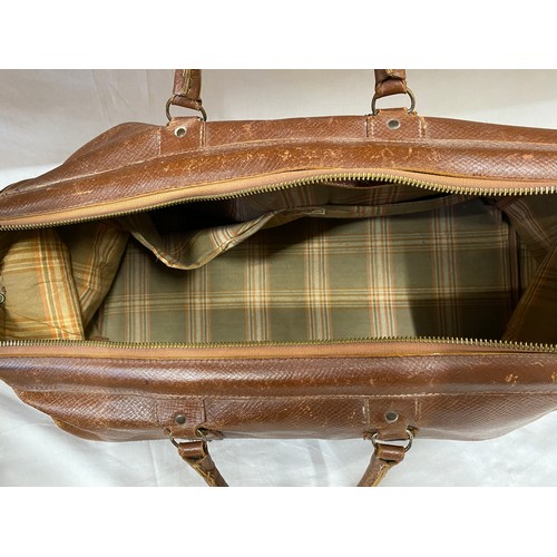 498 - A vintage brown leather suitcase contents to include a 1930's silk velvet bias cut green dress. Peti... 