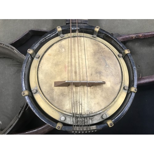 792 - A Marcelli banjo-mandolin with case, bowl size 19 d x 55cm l.