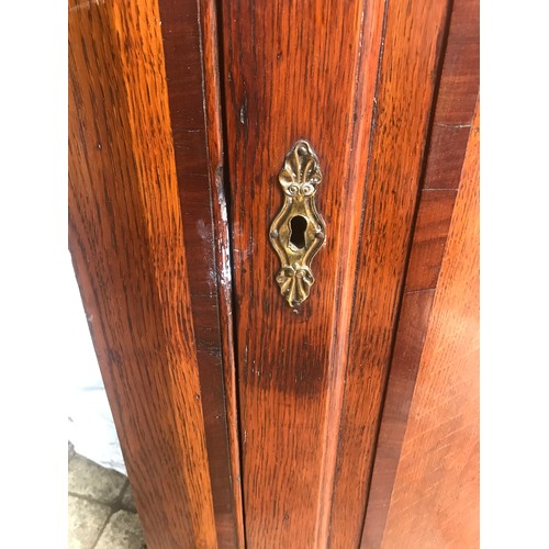 1185 - A 19thC oak inlaid corner cabinet. 74 w x 40 d x 107cm h.