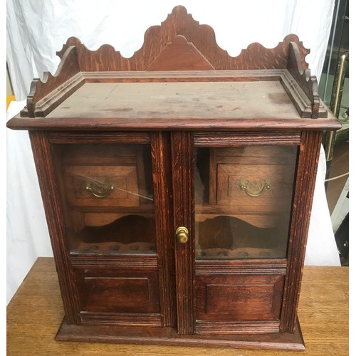 1186 - Oak smokers cabinet, glazed doors, fitted interior. 55 h x 45 w x 23cm d.