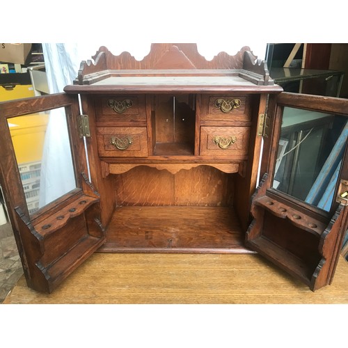 1186 - Oak smokers cabinet, glazed doors, fitted interior. 55 h x 45 w x 23cm d.