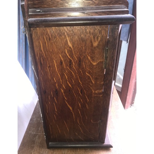 1186 - Oak smokers cabinet, glazed doors, fitted interior. 55 h x 45 w x 23cm d.