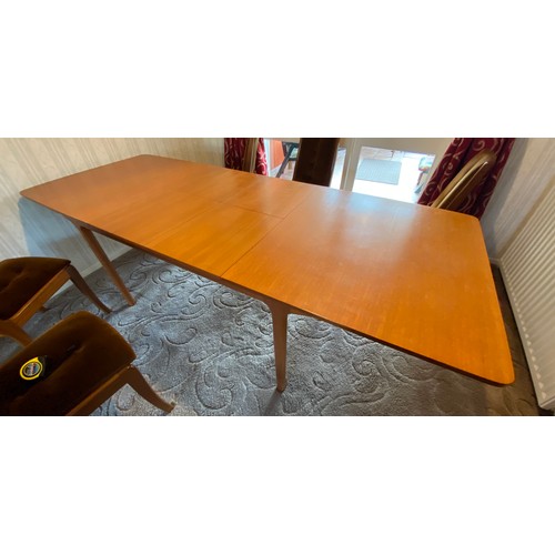 1190 - A Mcintosh vintage teak wood extendable dining table of rectangular form with six upholstered teak c... 