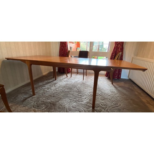 1190 - A Mcintosh vintage teak wood extendable dining table of rectangular form with six upholstered teak c... 