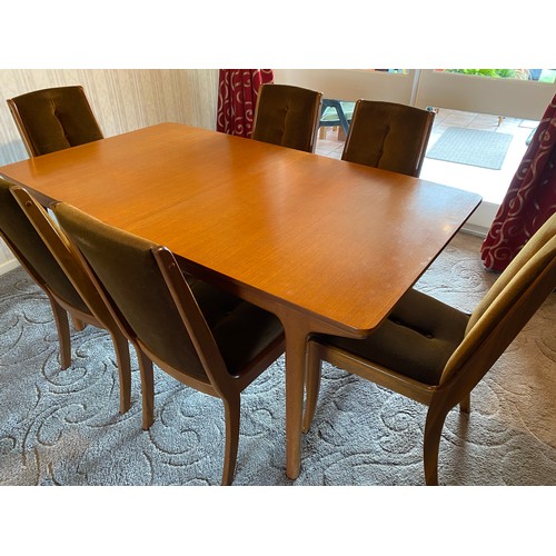 1190 - A Mcintosh vintage teak wood extendable dining table of rectangular form with six upholstered teak c... 